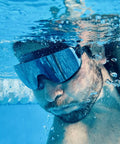 Underwater view of person wearing Frameless Ultralight Black Mirror Swim Goggles With VisiClear Nanotech Anti Fog Lens And 100 Percent UV Protection