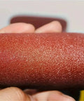 Close-up of a 4 inch aluminum oxide sanding disc from the 20 pack, ideal for wood, metal, and composite work.