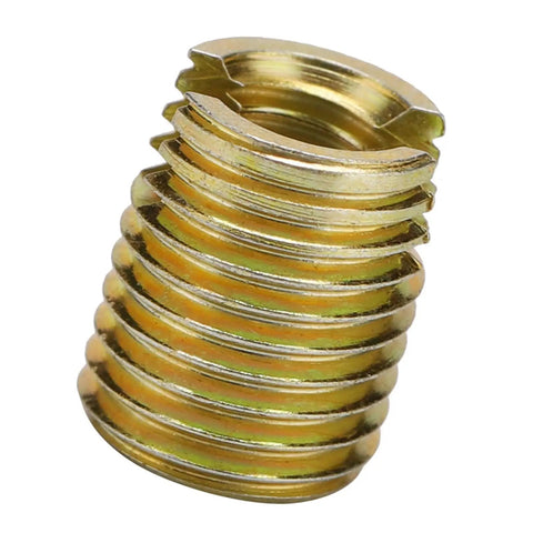 Close-up of tough carbon steel self-tapping thread insert with yellow zinc plating for repair jobs in cars and electronics.