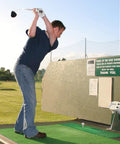 Golfer swinging at driving range using Durable Golf Rubber Tees 5 Pack With Mixed Sizes From 1.5 Inch To 3.13 Inch For Indoor And Outdoor Practice.