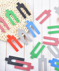 Pro Grade Leveling And Spacing Shims Kit With 150 Pcs U Shaped Tile Spacers in assorted colors displayed on a surface