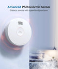 Smoke Detector With Ten Year Sealed Battery For Home Fire Warning And Family Safety System Quick Setup mounted on a wall.