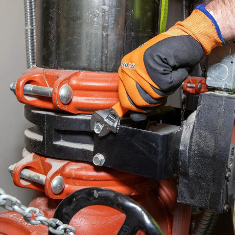 Worker using Beefy Adjustable Wrench With Extra Capacity Jaw For Bigger Jobs In Tight Spaces One And A Half Inch Capacity Precision Forged Steel