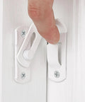 Close-up of Four Pack Matte White 90 Degree Flip Barn Door Lock Latches being engaged with a hand, ideal for secure installations.