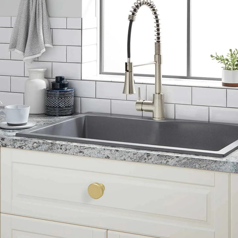 10 Pack Brushed Gold Cabinet Knobs With Gold Knurled Drawer Pulls installed on kitchen drawer under granite countertop and silver faucet