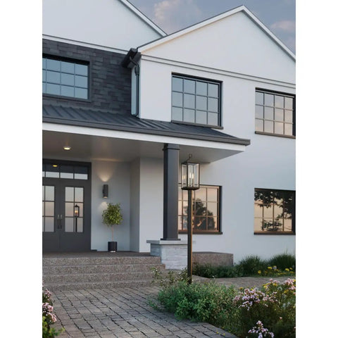 6-Inch Outdoor LED Cylinder Wall Sconce 2-Light Up And Down Mount shown on porch at dusk, modern exterior setup, black finish.