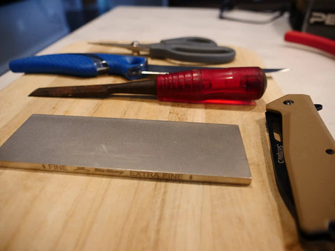 Two Sided Diamond Sharpening Stone with tools, 6 Inch Bench Stone for fine and extra fine grits, used for sharpening knives and chisels.