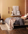 Relax LED Candle Light Bulbs Soft White 40 Watt Equivalent in cozy bedroom ambience with warm tones and decorative elements.