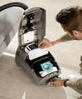 Man installing Genuine HEPA AirClean Filter SF HA 50 in vacuum for improved air quality