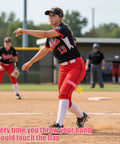 Softball Pitching Training Aid For Clean Mechanics And Realistic Throws demonstrated by player on field with elastic band