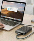 Person using MacBook with Portable External Hard Drive 1TB USB 3.0 USB-C Storage Expansion for PC Mac Desktop Laptop