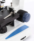 Close-up of 40X To 1000X Monocular Compound Microscope with rotating head and LED, focus knob and stage visible