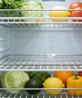 Image of 8 Pack Aluminum Shelf Clips for Fridge and Freezer on a refrigerator shelf with vegetables, showcasing smooth surface and durability.