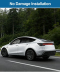 Sleek Rear Trunk Spoiler Tail Wing For Tesla Model Y Juniper 2025 2026 No Drill Install showcasing aerodynamic design on highway.