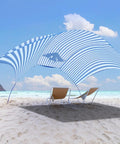 Wind-Powered Beach Shade Canopy No-Fuss Easy Setup Sun Shelter Tent With UPF 50+ UV Protection on a sunny beach