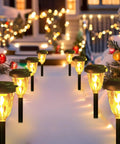 Outdoor Christmas scene with lit pathway lights, snow, and festive decorations, not showing Lit Outdoor String Lights 50ft S14 LED Bulbs Extendable Up To 250ft Waterproof IP65 Shatterproof Vintage Edison Style For Patio Pergola Backyard Deck Energy Efficient Commercial Grade