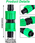 Green plastic 5/8-inch universal drip irrigation coupling with black compression fittings (front view)
