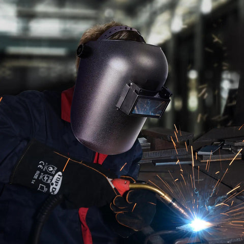 Welder using Auto Darkening Welding Helmet With Flip Front Viewing Area 3.86 By 1.61 Inches, Adjustable Headgear, Shade 11 during welding.