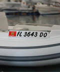 Marine Registration Plate Kit For Inflatable Boats And Ribs No Glue Needed 4 By 24 Inch ABS Mounting Boards With Zip Ties Saltwater Resistant Made In USA Pair installed on an inflatable boat.