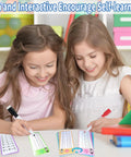 Children using Add Up Fast 1 To 12 Addition Flash Cards Set With Large Times Table Chart and markers for math practice.