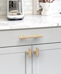 10 Pack 3 Inch Gold Knurled Cabinet Pulls Brushed Brass Kitchen Cabinet Handles installed on gray kitchen cabinets