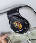 Porsche Sunglasses Holder Car Clip For Visor One Hand Operation Leather Eyeglass Clip on Panamera visor with glasses in use.