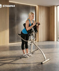 Woman using InLine Traction Control System for back pain relief and spine decompression, home gym stretch gear.