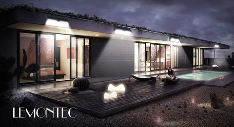 Modern house exterior with 62 LED Solar Wall Lights With Motion Sensor Outdoor Security Lighting illuminating the patio at night