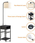 Space Saving Floor Lamp With Built In End Table And Storage Shelves, Linen Shade, Upgraded Long Cord, Easy Foot Switch, Cool End Table Lamp For Bedroom Or Living Room, Black Modern Lighting with flax material lamp shade and three shelves.