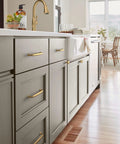 Renown Champagne Bronze Cabinet Pull Five And One Sixteenth Inch Center To Center Traditional Drawer Handle installed on kitchen cabinets