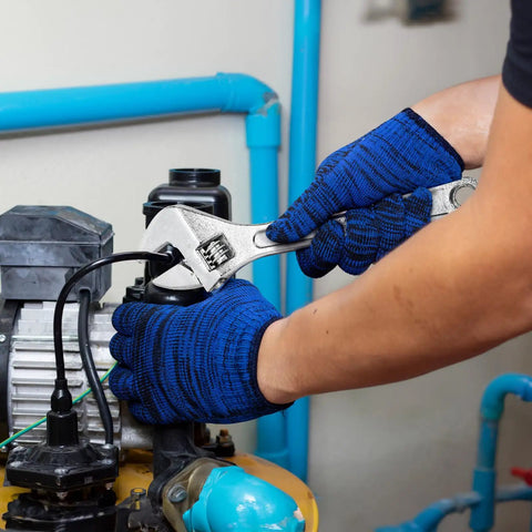 Person using Four Piece Adjustable Crescent Wrench Set With 6 8 10 12 Inch Wrenches Made From CRV Steel on plumbing pipes