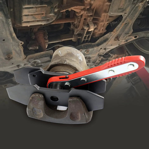 JoyFans brake caliper compression tool set with red handle and black spreader arms on a car brake caliper.