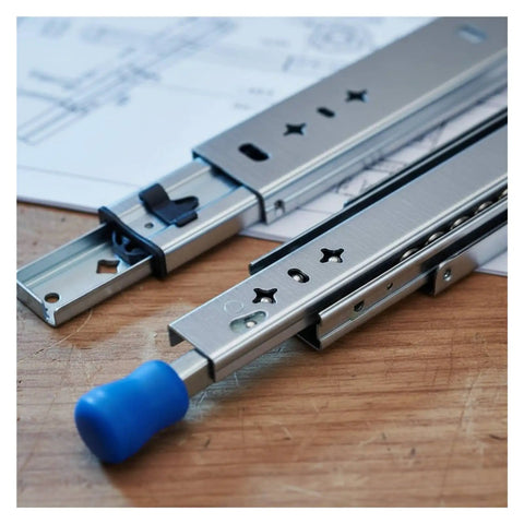 High Octane Heavy Duty Side Mount Ball Bearing Drawer Slides With Triple Extension Full Reach Cold Rolled Steel Cabinet Rails close up view on a wooden table.