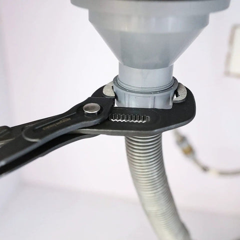 Close-up of Three Piece Quick Release Groove Joint Pliers Set With Adjustable Slip Joint Pliers gripping a pipe connection