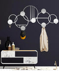 Abstract Metal Wall Hanger With Geometric Coat Hooks, Killer Wall Art For Entryway, Modern Silver Coat Rack Organizer 53x26 Inches displaying hats and coats.