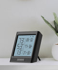 Smart Temp Humidity VPD Hygrometer B2 With LCD Display on shelf, showing temperature and humidity readings.