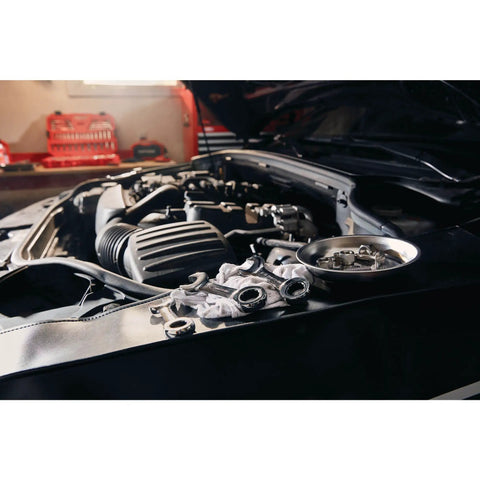 Car engine bay with 7 Piece SAE Ratcheting Wrench Set With 72 Tooth Box End 15 Degree Offset Chrome Finish tools on fender