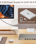 Drop-In 54V 3.9A 210W Power Adapter For UniFi XG 6 PoE Gear, Plug-And-Play Replacement White Power Supply For US-XG-6POE And USW-Ultra-210W 6/8-Port Switches, shown connected