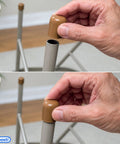 Man installing Top Shelf Folding Chair Leg Caps 7/8 Inch Beige Foot Guards on metal chair legs for protection.