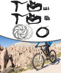 Heavy Duty Mechanical Disc Brake Set For Mountain Bikes With Front And Rear Calipers, 160mm rotors and levers displayed outdoors.