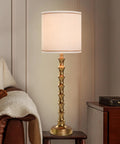 Gold Buffet Lamps Set Of 2 Tall Skinny Candlestick Style Lamps For Living Room And Dining Room on wooden table near armchair