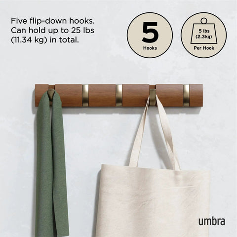 Flip Wall Mounted Coat Rack With Retractable Hooks in use holding a green scarf and beige bag in Light Walnut and Gold.
