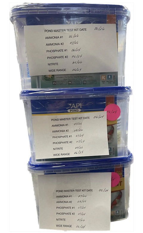 POND MASTER TEST KIT includes multiple test bottles for ammonia and phosphate quality checking with labels and dates.