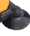 Close-up of the sweeping brush on a 26 8 Inch Manual Walk Behind Floor Sweeper With 4 Gallon Waste Bin Built Like A Tank For Warehouse Garage Driveway.
