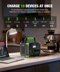 1000W Portable Power Station 999Wh Solar Generator With 200W Solar Panels charging devices at kitchen countertop with various outlets