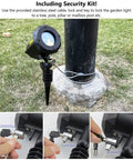 Garden Laser Christmas Lights Projector with Moving Firefly Stars, secured to post, showing security kit setup details