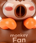Rechargeable Usb Desktop Cooling Fan For Mugs And Bottles With Adjustable Speed Settings To Keep Coffee Tea Milk Water Frosty And Beat The Heat All Day Long, designed as a cute monkey with orange accents.
