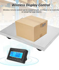 Commercial Grade Digital Shipping Scale With Wireless Display And Bullyproof Stainless Steel Platform 992 Lb Heavy Duty Postal Scale weighing a box.