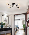 Industrial Semi Flush Mount Four Light Ceiling Fixture With Adjustable Black Metal Branches, E26 Base in a living room setting.