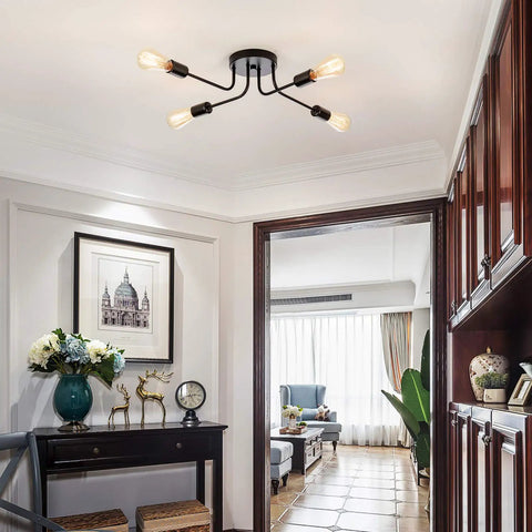 Industrial Semi Flush Mount Four Light Ceiling Fixture With Adjustable Black Metal Branches, E26 Base in a living room setting.